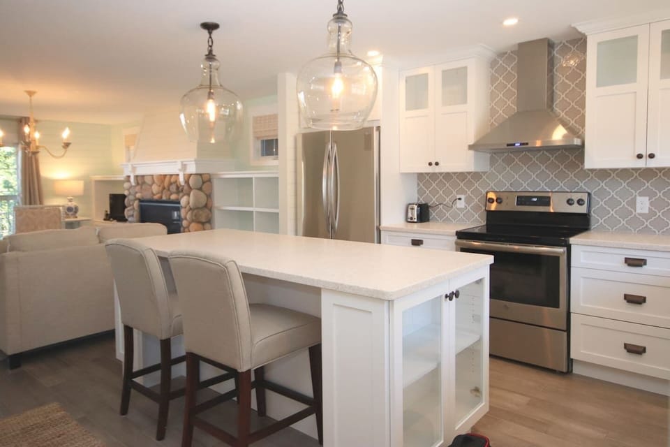 Open concept living room, kitchen, and dining. 
