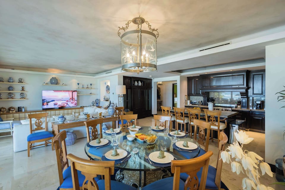Open-concept dining and living area with stylish décor, ample natural light, and a warm inviting atmosphere.