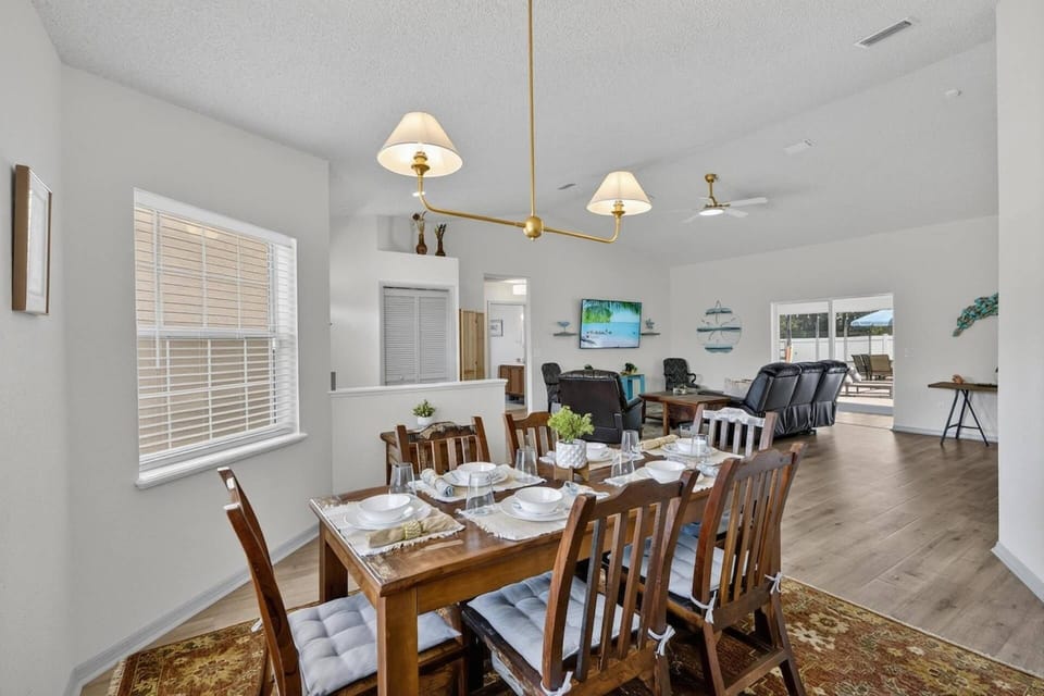 Bright dining room with front yard views, open to living room and just off the kitchen, perfect for easy flow and gathering.