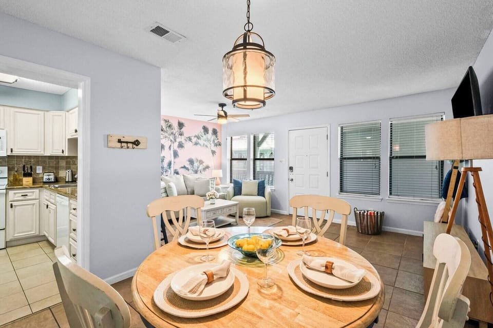The dining room can easily fit up to 6 with stored chairs in the closet.