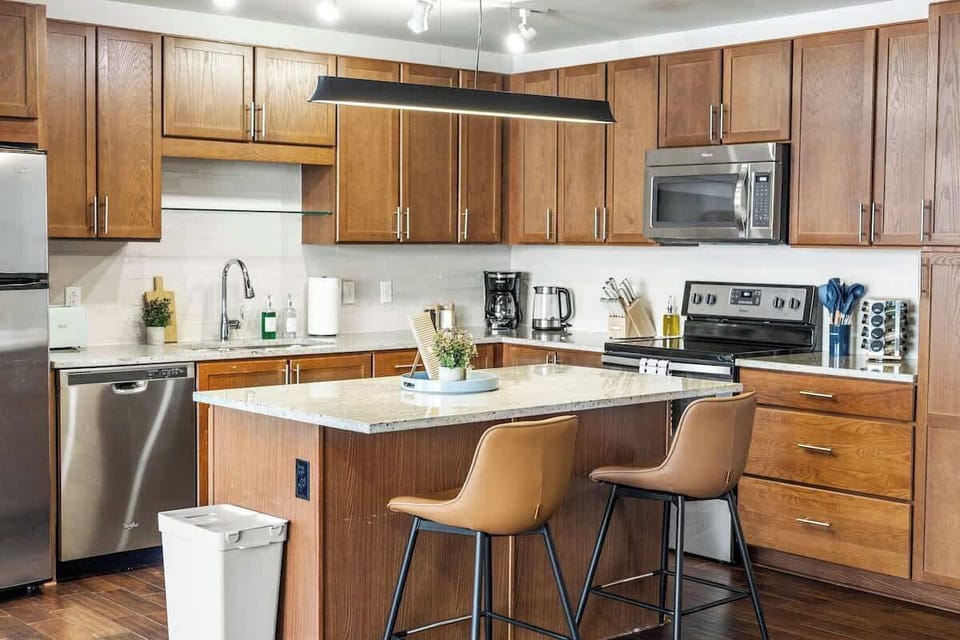 Enjoy a sleek kitchen island, perfect for meal prep, casual dining, or hanging out while cooking. A spacious area that seamlessly combines function and style.