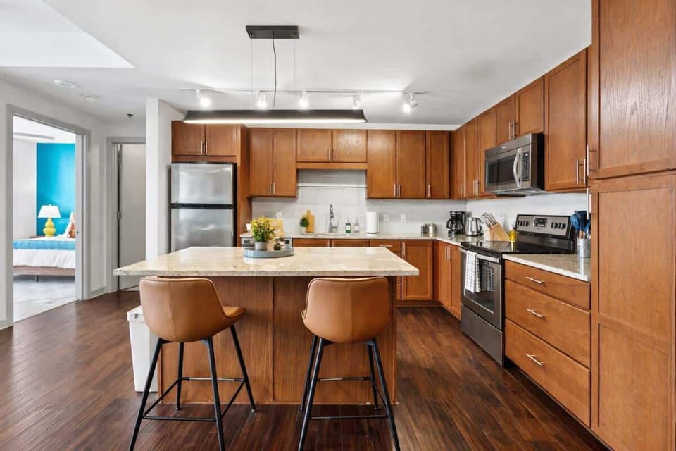 Fully equipped kitchen with modern appliances, ample counter space, and a functional layout for cooking and dining.