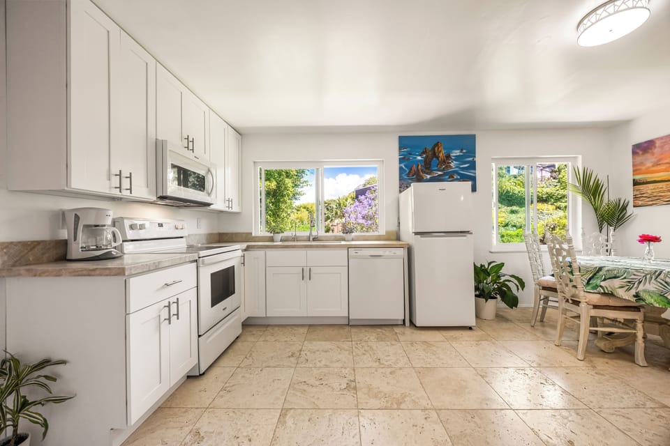 Modern kitchen with full-size appliances, ample counter space, and natural light throughout.