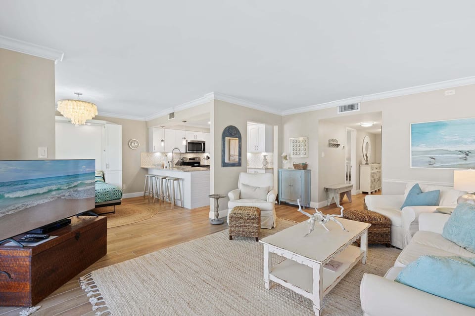 This inviting beach stay features an open-concept layout with coastal décor, cozy seating, and a modern kitchen. Perfect for family vacations, weekend getaways, and relaxing after a day at the beach.