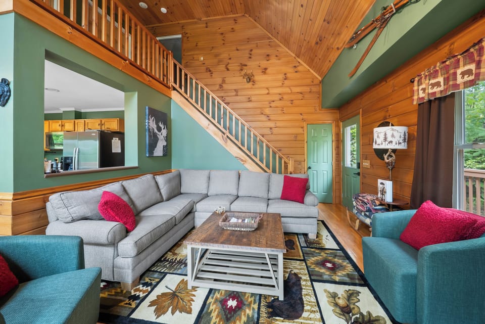 Gather the whole crew in this roomy, mountain-themed living room under soaring vaulted ceilings at The Mountain Hearth II.