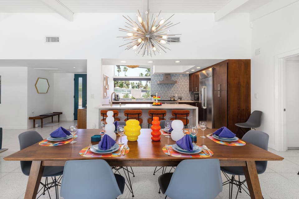 Table and seating for 6 guests, plus additional seating at the island.