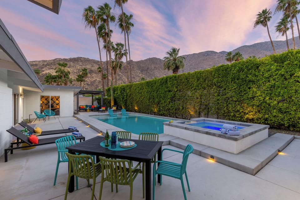 Private pool spa, outdoor seating, BBQ grill, and corn hole.