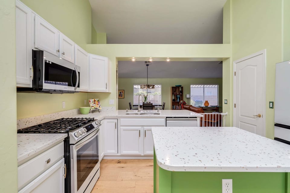 New Samsung white glass front appliances, plenty of counter space, kitchen island, counter seating for 2, and breakfast nook.