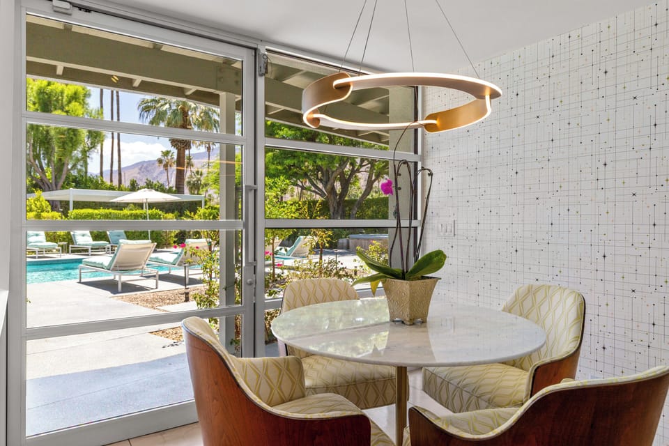 Perfect spot for a morning cup of coffee! Direct access to the back patio and pool/spa.
