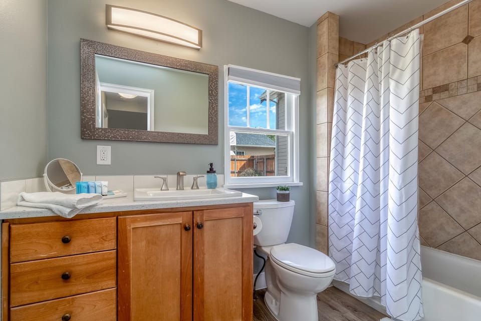 Tub and shower combo plus vanity space for easy daily routines.