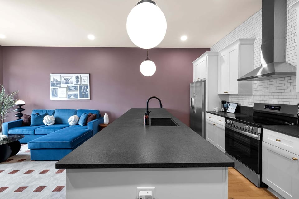 Dark stone counters and stainless steel appliances make this kitchen the real showstopper.