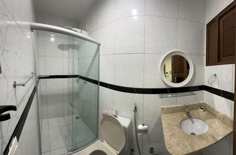 Deluxe Triple Room, Air conditioning | Bathroom | Hair dryer, towels, soap, toilet paper