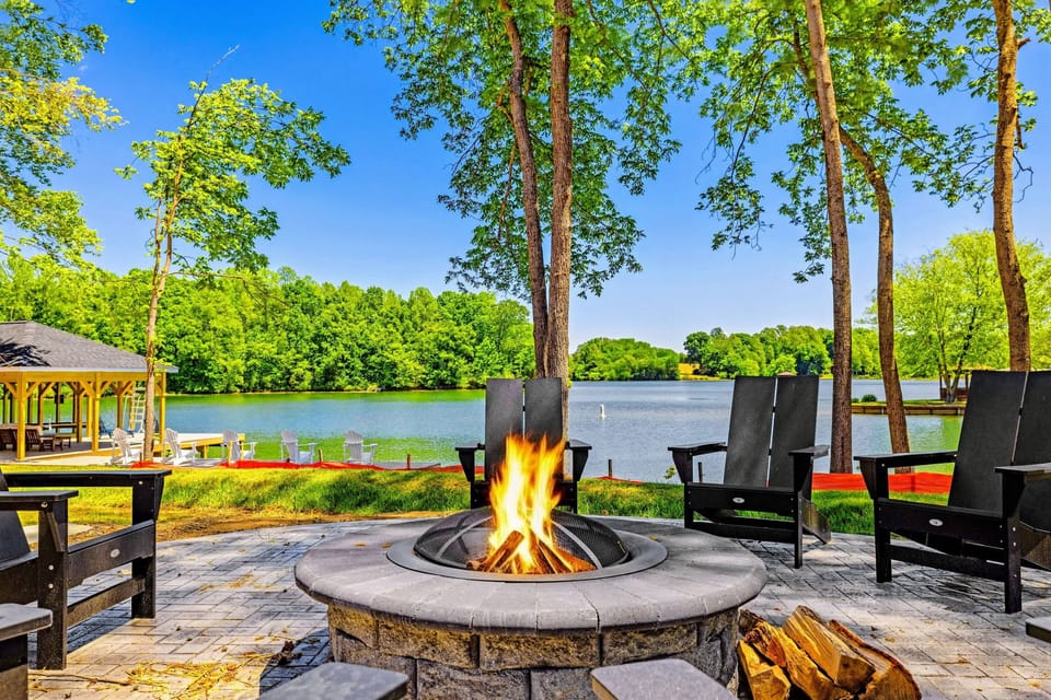 Fire Pit - A glowing fire pit with Adirondack chairs opens straight onto the lake, perfect for unwinding as the day winds down.