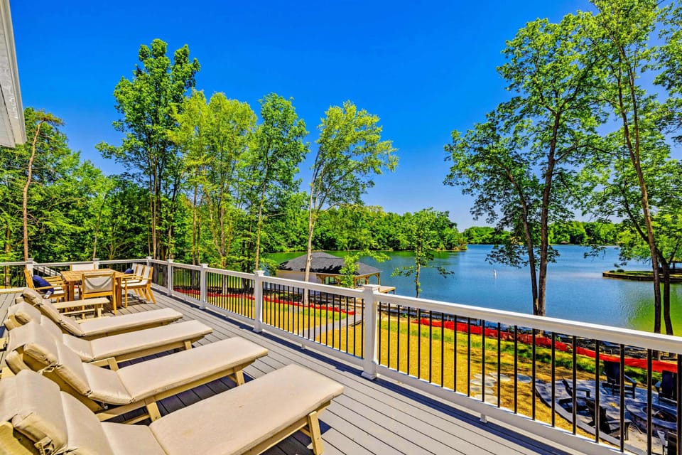 Sun Deck - A row of loungers along the open deck rail soaks up the afternoon sun.