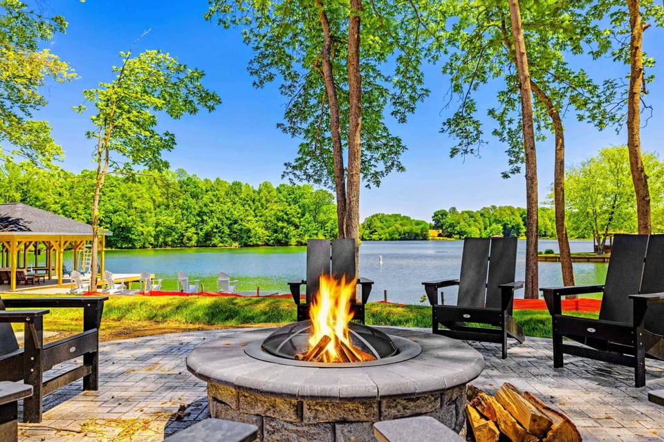 Fire Pit - A glowing fire pit with Adirondack chairs opens straight onto the lake, perfect for unwinding as the day winds down.