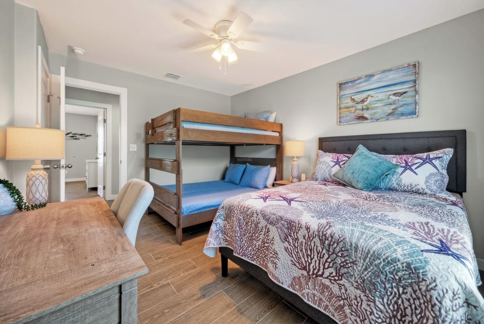 Fifth bedroom with a queen bed and queen-over-queen bunk bed for kids and adults.