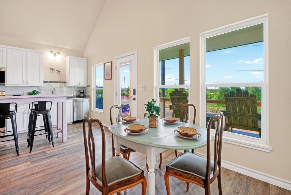 Dining nook with porch views, perfect for casual meals after a day by the bay.