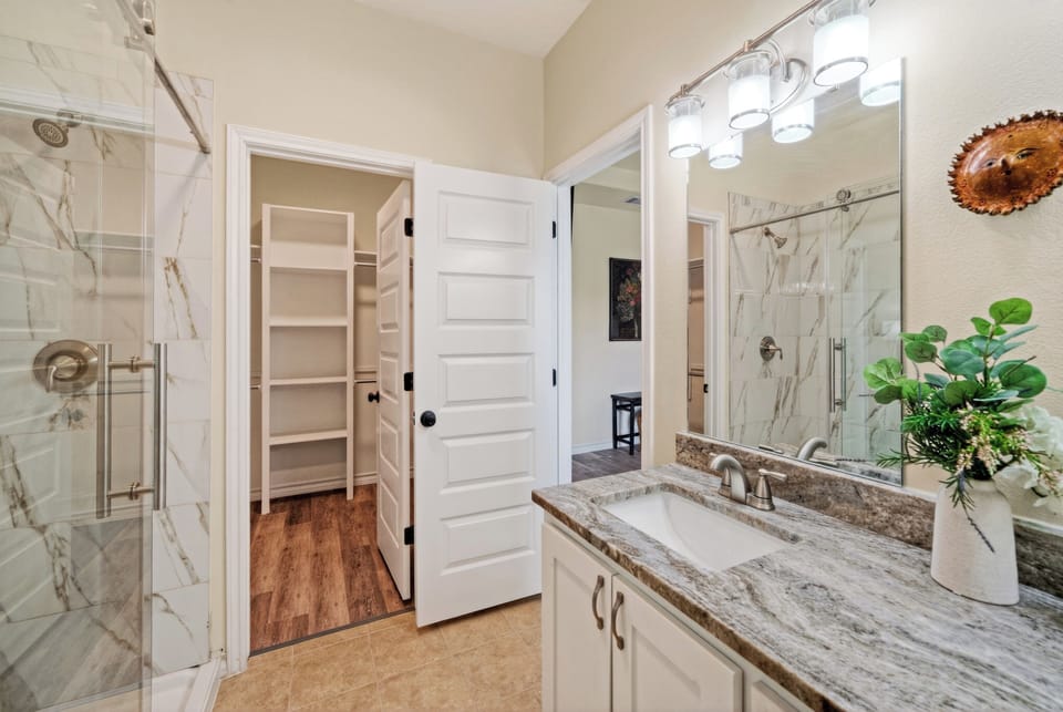 The primary bedroom's ensuite features a shower.