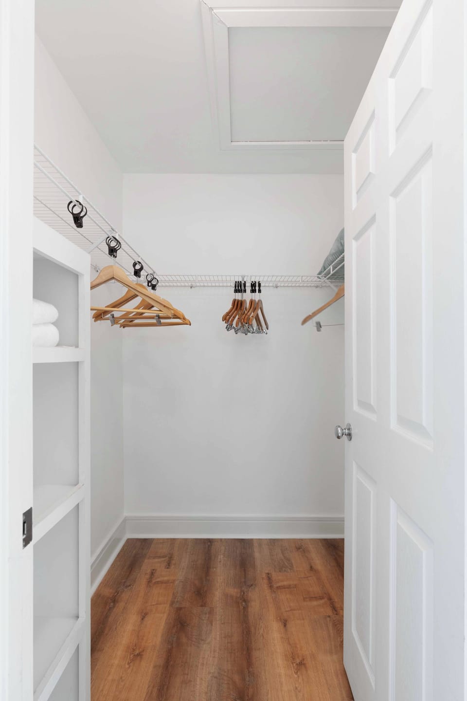 Expansive walk-in closet with built-in organizers and plenty of storage for your beach wardrobe.
