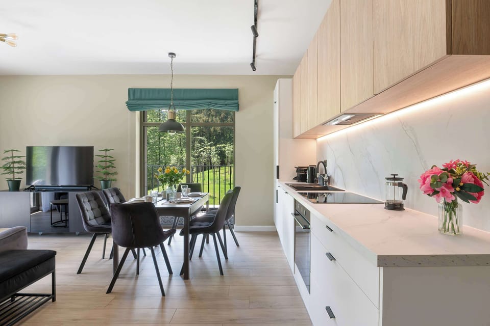 The living room has a modern look and comfortable furniture.