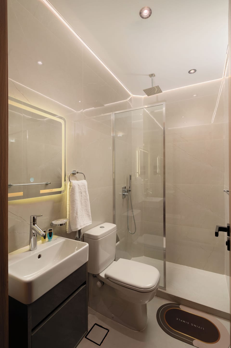 Separate tub and shower, hair dryer, slippers, towels