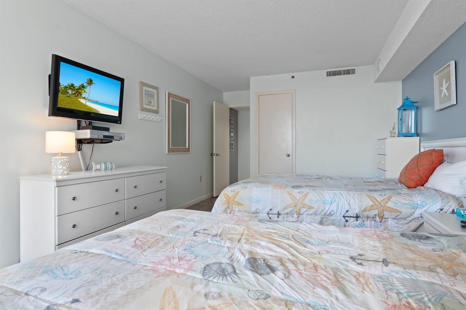 2nd Bedroom with double beds and balcony access