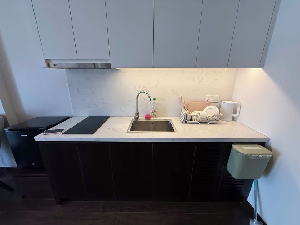 Mini-fridge, stovetop, cookware/dishes/utensils
