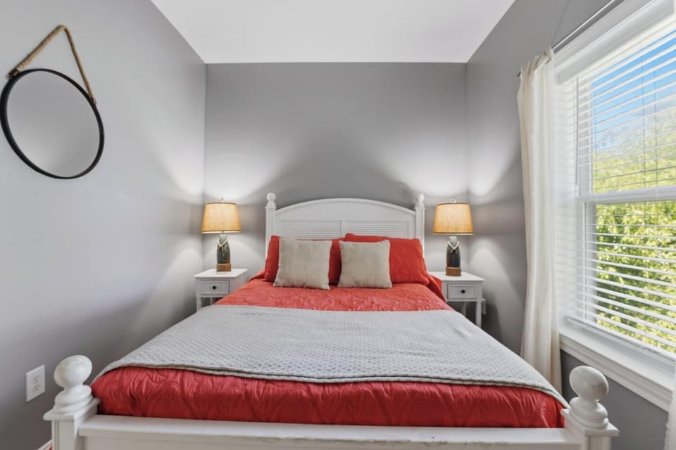 Drift off in your cozy bedroom with soft light, stylish décor, and a serene view through the window—your perfect retreat after a day of exploring.