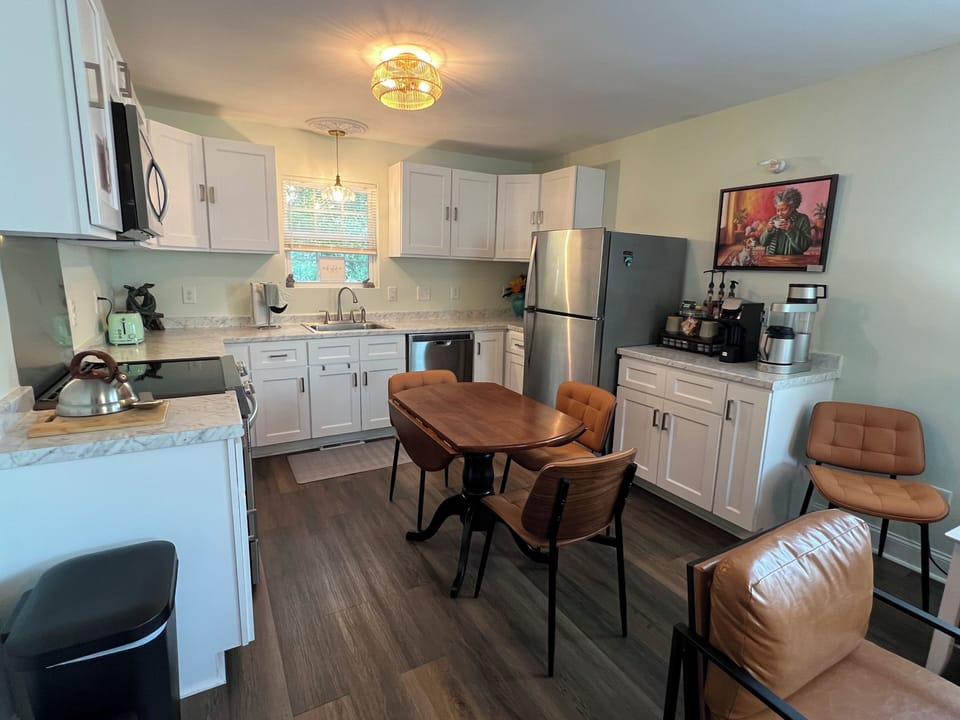 Enjoy our spacious kitchen & open dining area, featuring a dedicated coffee bar.