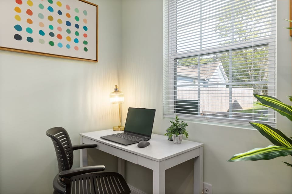 This dedicated desk setup faces the window, giving you a serene view to enjoy.