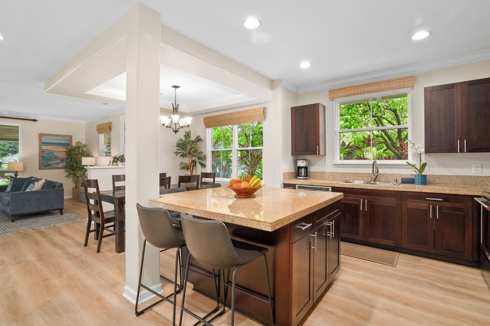 The open kitchen layout keeps everyone connected from breakfast through evening gatherings.