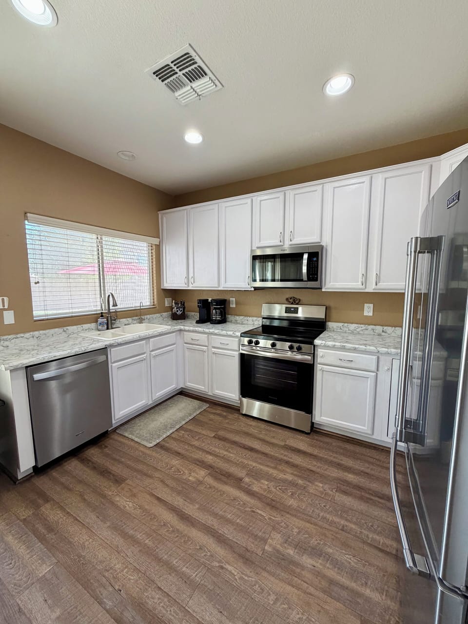 Kitchen with updated oven, microwave and dishwasher!