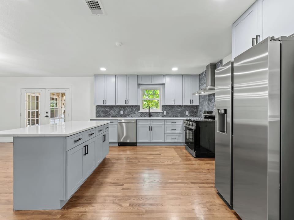 Prepare memorable meals in your spacious gourmet kitchen with gleaming stainless steel appliances and elegant marble countertops.
