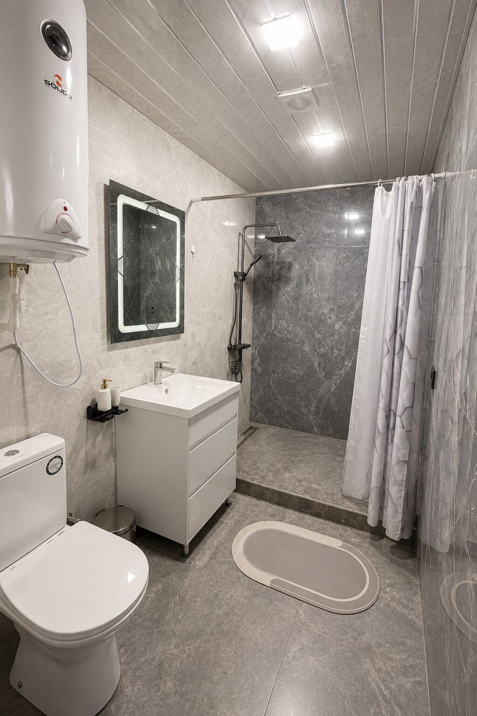 Deluxe Quadruple Room, 1 Queen Bed with Sofa bed, Mountain View | Bathroom | Shower, free toiletries, slippers, towels