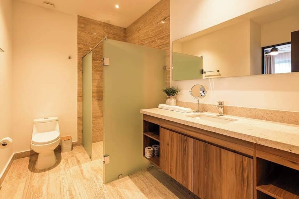 Full bathroom with walk-in shower and vanity