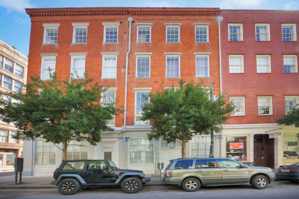 Historic corner building blending classic New Orleans architecture with modern boutique accommodations in a prime downtown location.