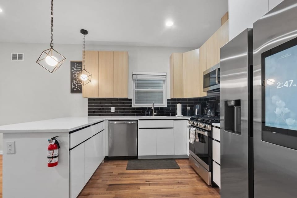 Clean and modern kitchen with plenty of storage and prep space for quick breakfasts or family-style dinners.