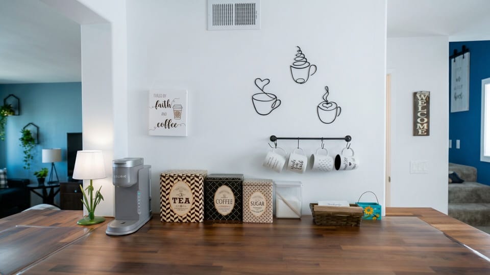 Coffee bar with Keurig machine, tea, coffee, sugar, stirrers and cups. 