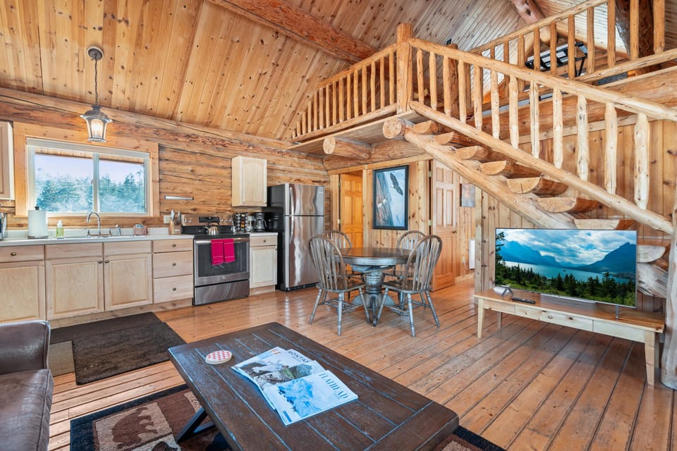 Open plan kitchen with dining area, wood cabinets, and stainless steel appliances