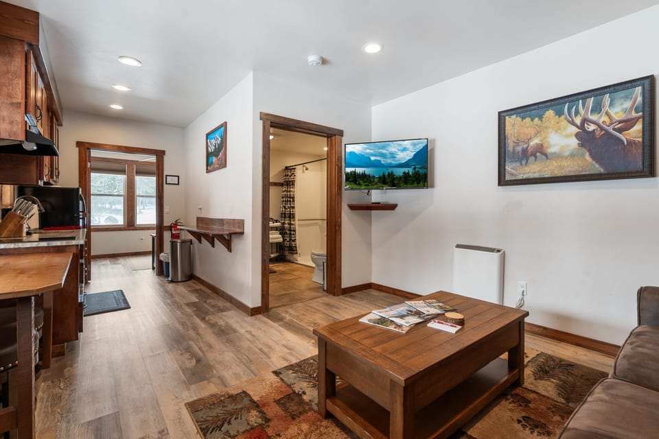 Living area looing into kitchen and bedroom entrance