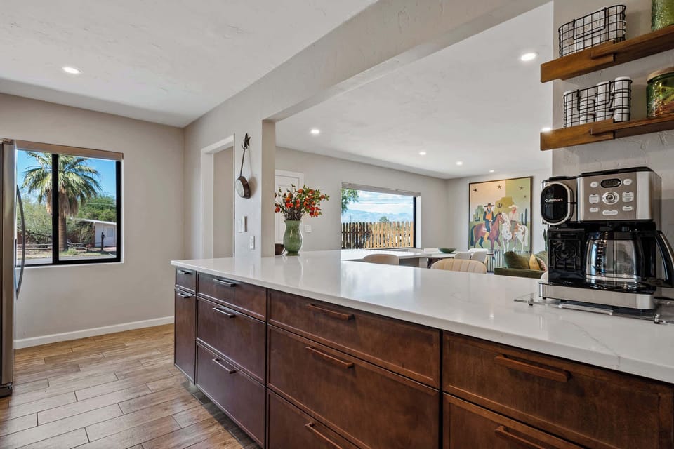 Kitchen with open bar/service area and coffee bar.