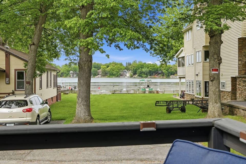 Front porch seating area — morning coffee with a view of the trees