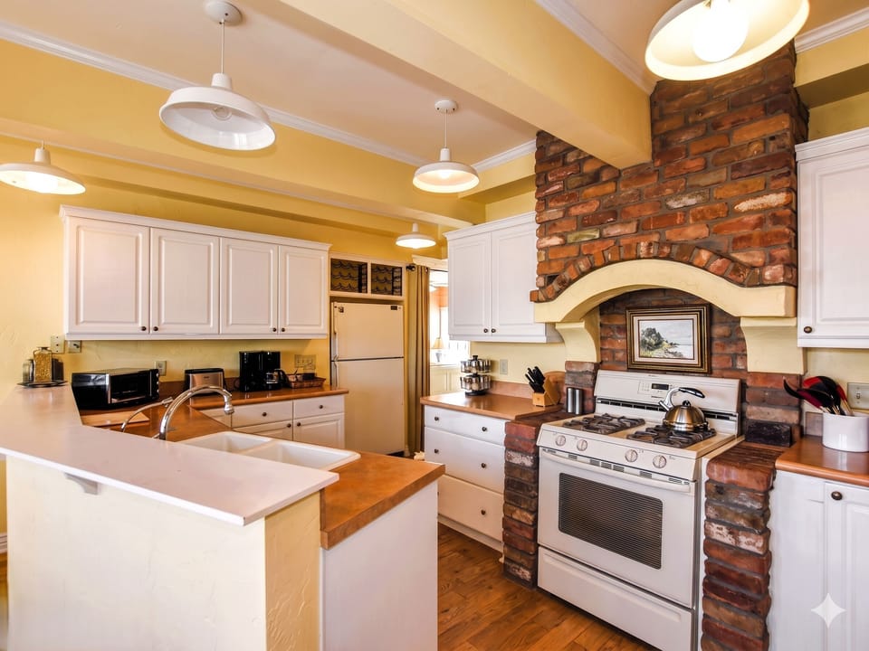 Cooking is a breeze in this fully equipped kitchen, featuring modern appliances and ample counter space.