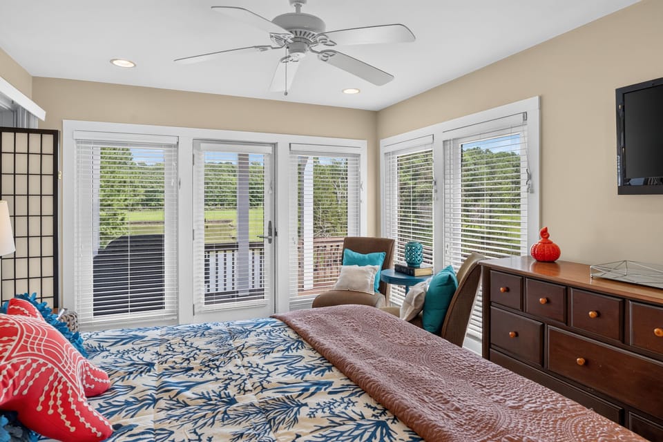 Primary Bedroom with Water Views and a Sitting Area