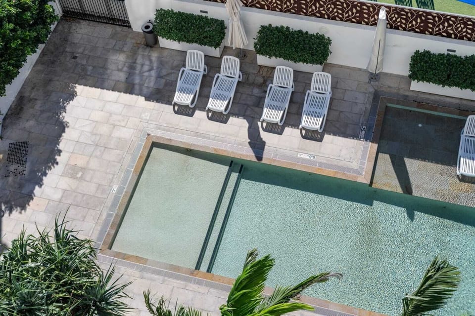 Cool off with a swim, then relax on the loungers.