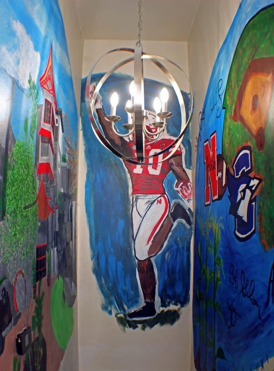 Mural above the staircase leading down to the basement
