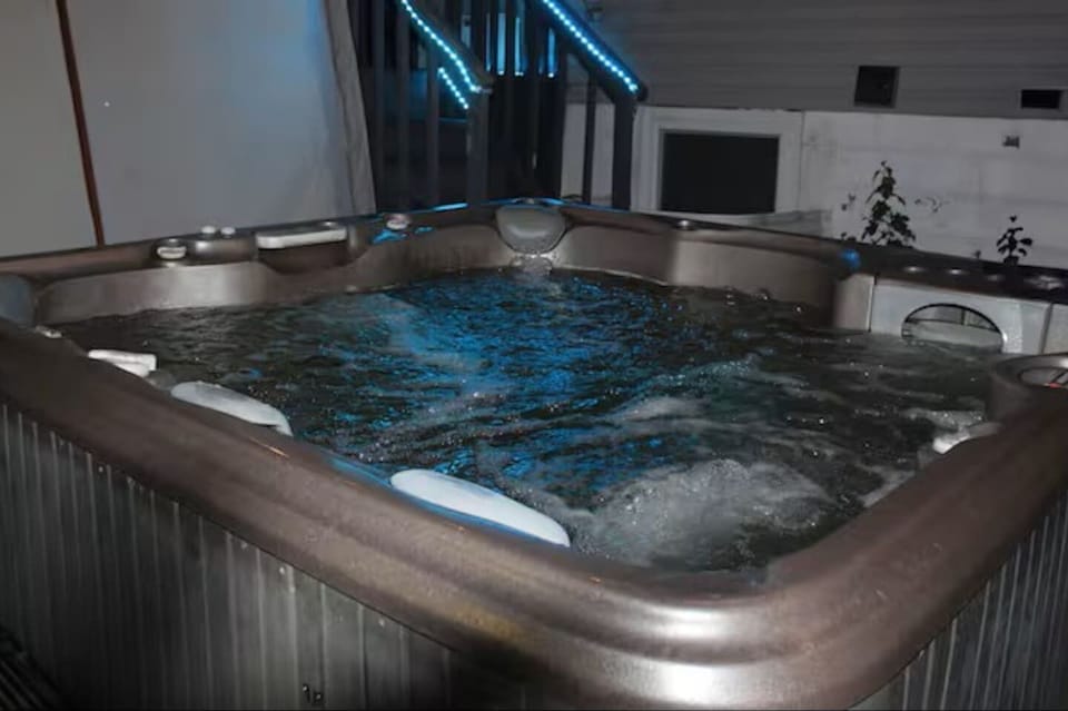 Hot tub in backyard at night