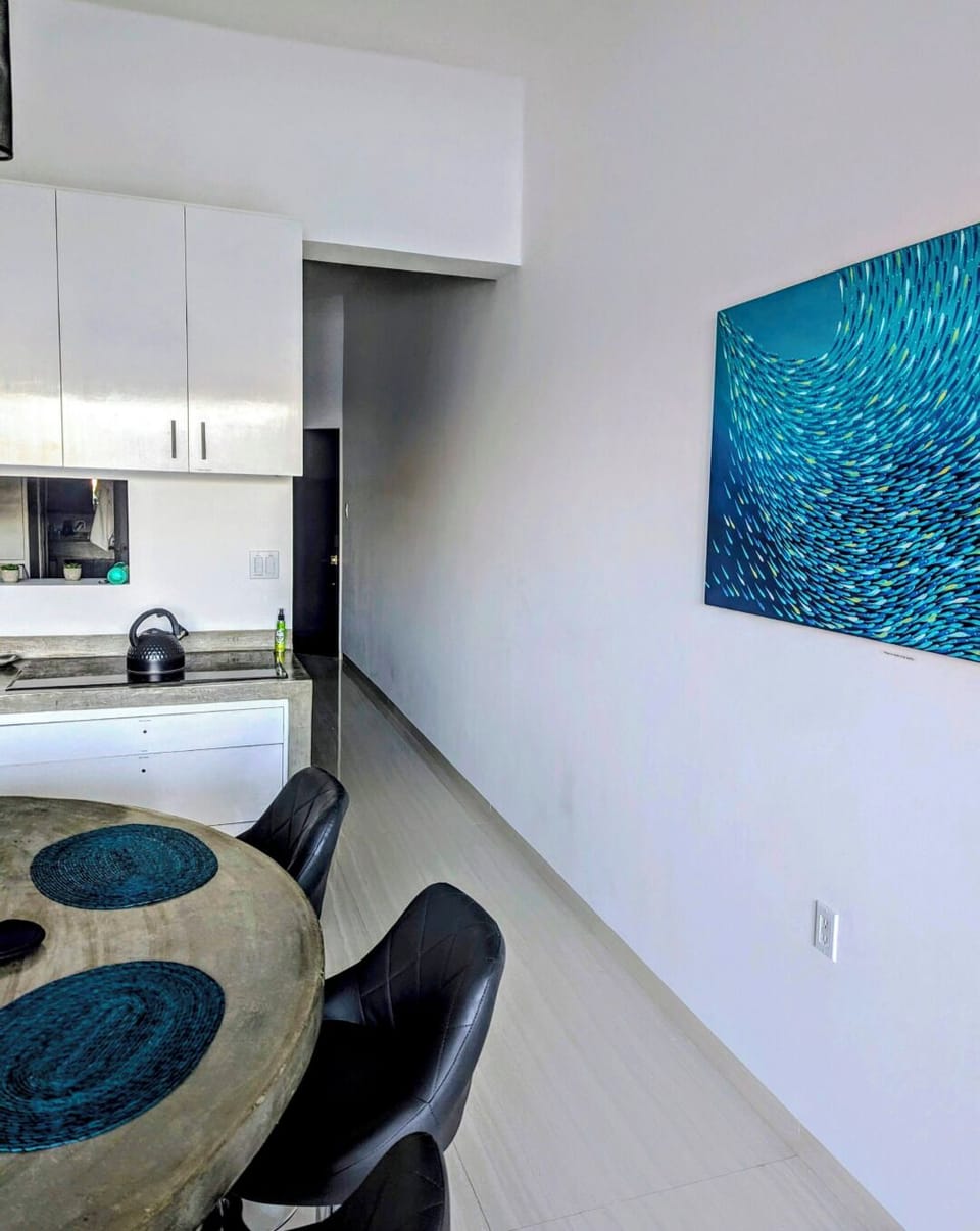 Open concept layout with coastal decor and modern finishes