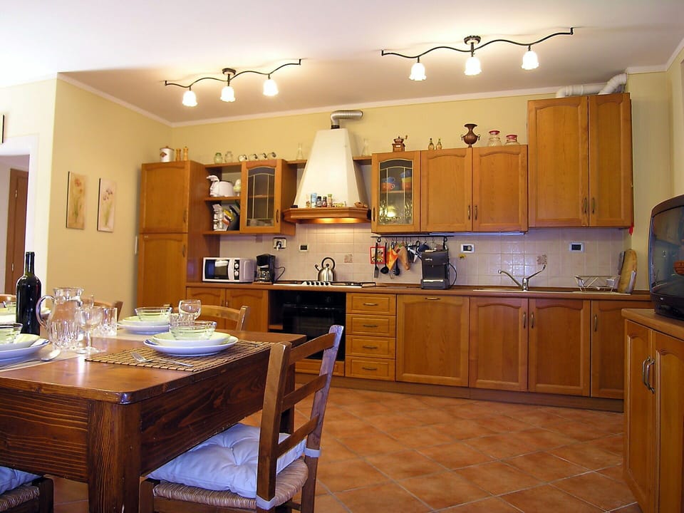 Cabinetry, Furniture, Countertop, Table, Home Appliance, Wood, Kitchen, Interior Design, Lighting, Kitchen Appliance