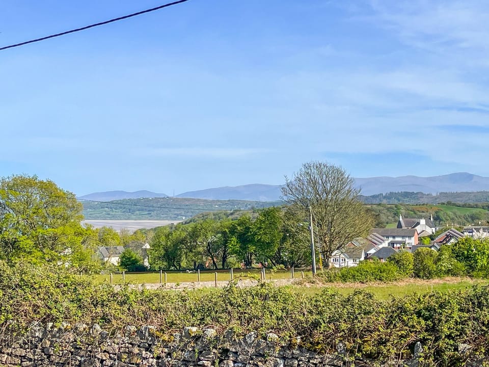 View of Red Wharf Bay from the lounge window | Penbryn Cottage, Benllech